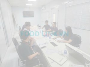 Business meeting in Vietnam between seafood factory and international customer